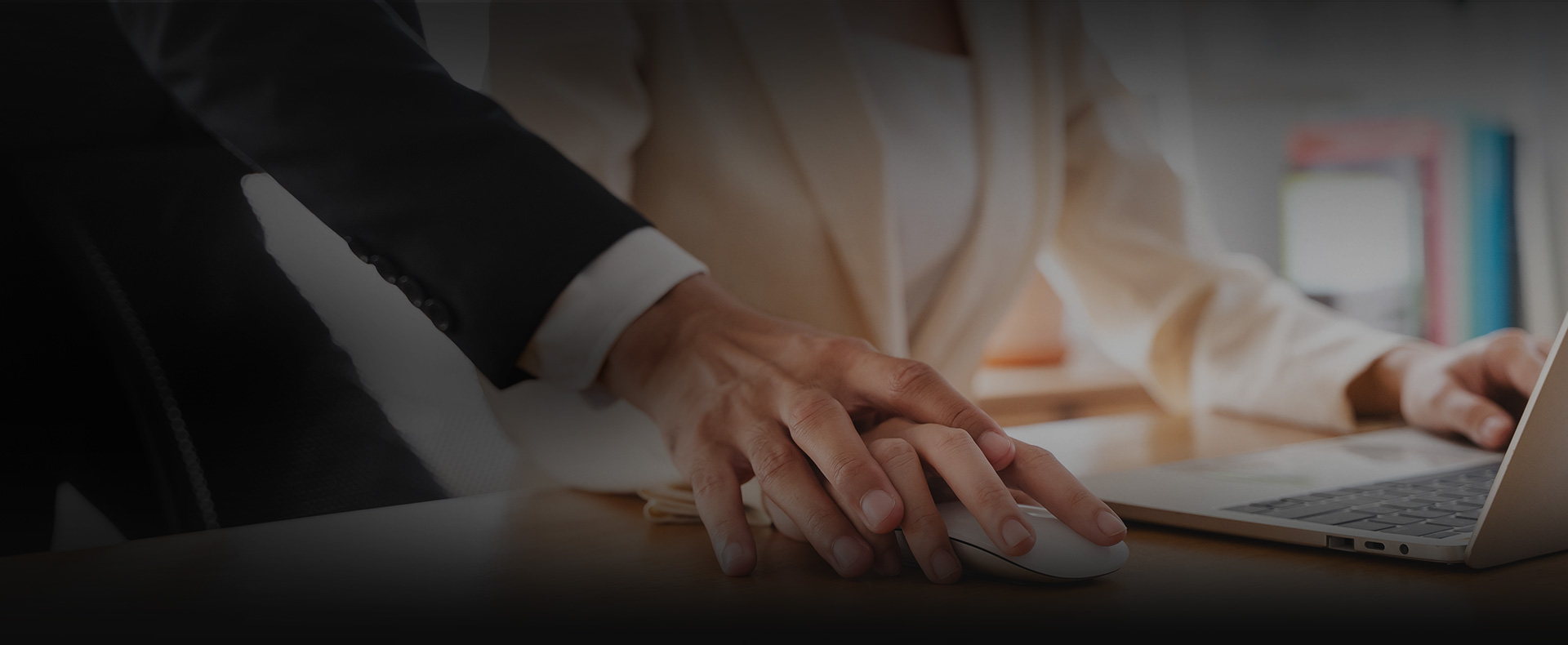 man places hand on woman's hand