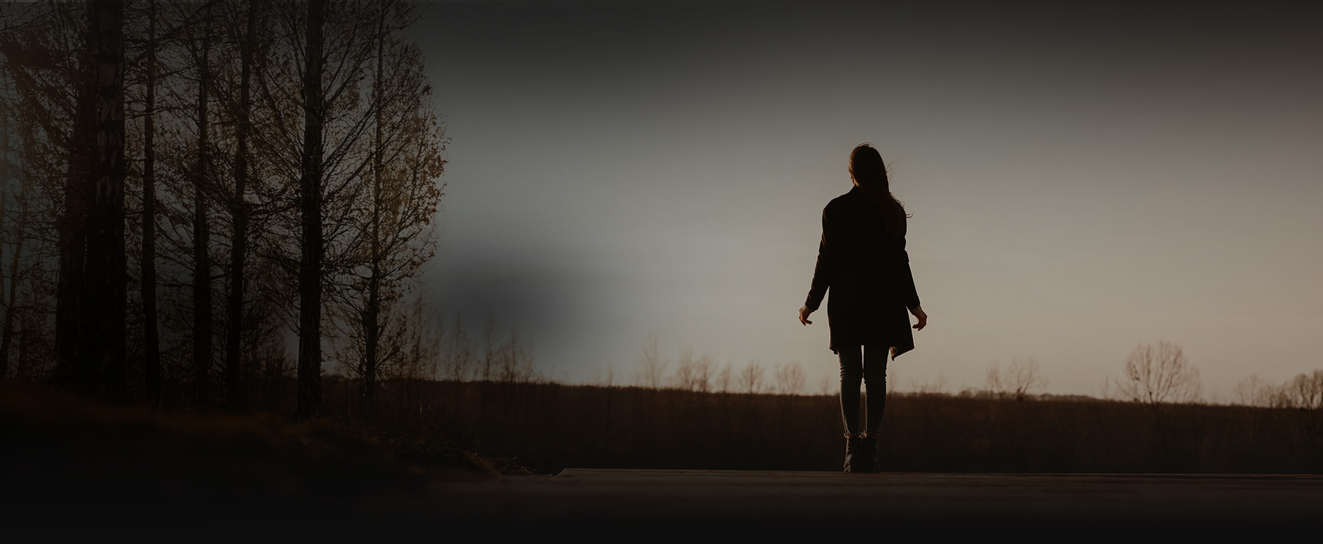 Woman walks on road alone