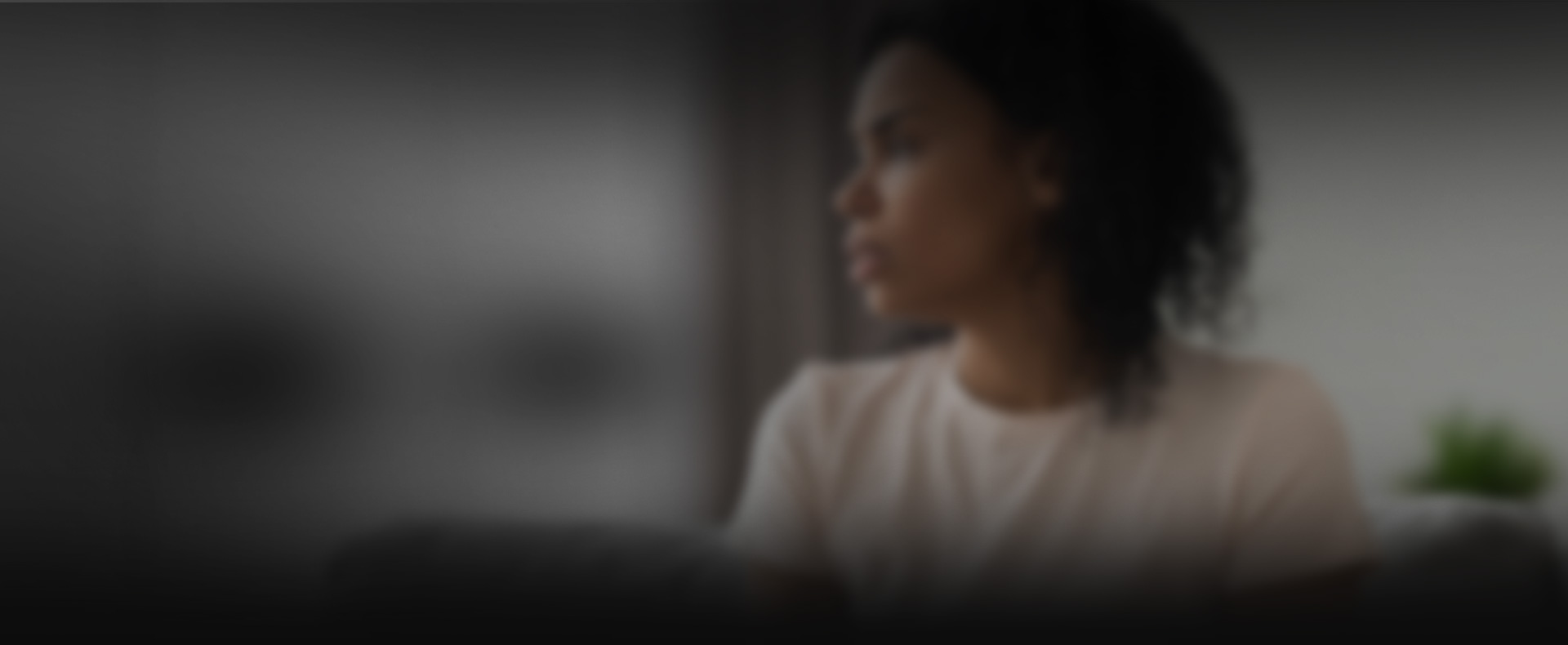 Woman looks out window