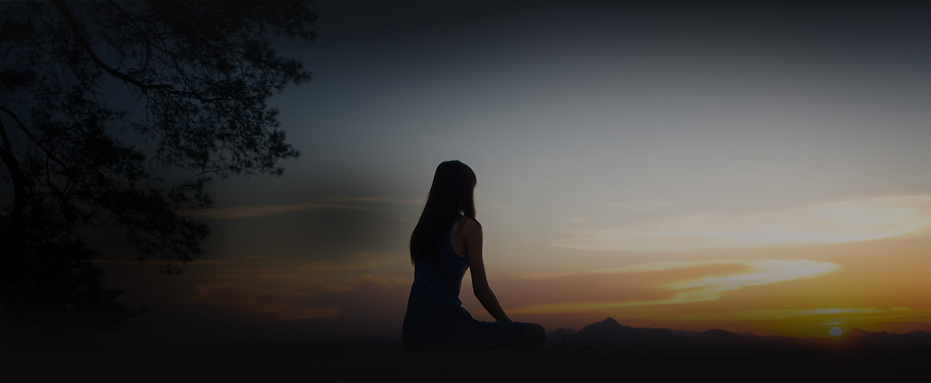 woman looking at sunset