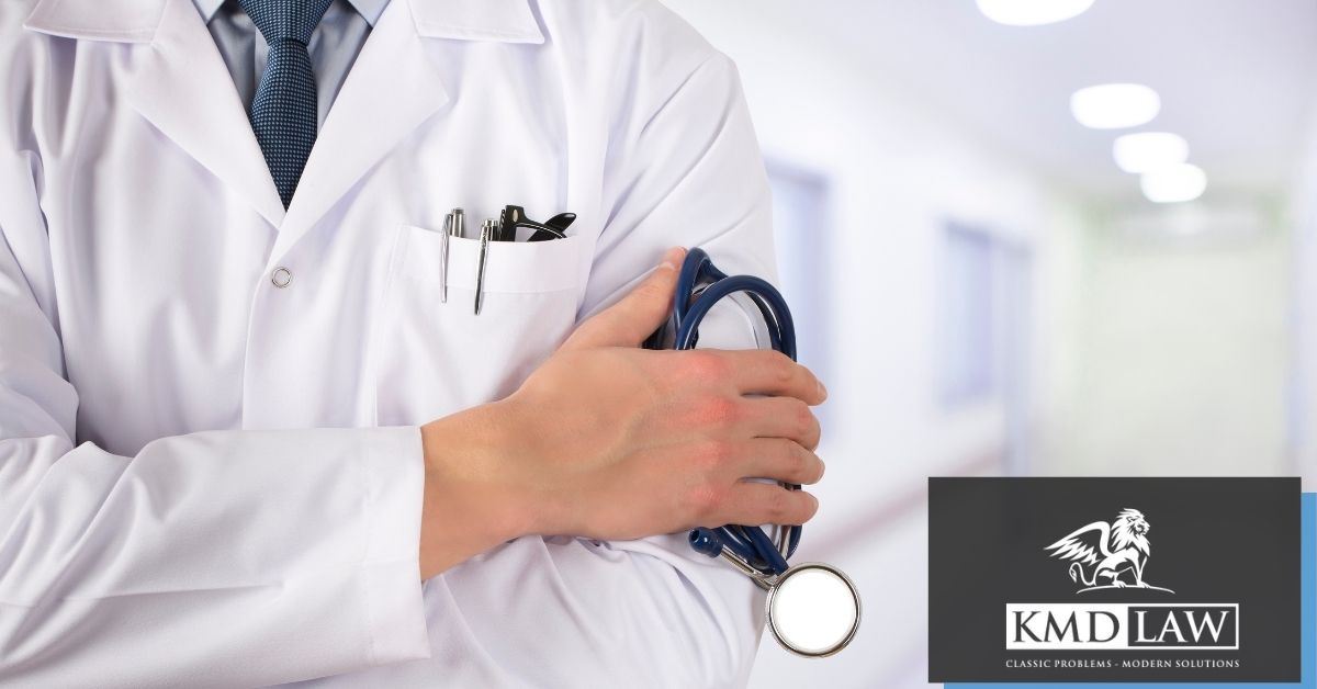 Doctor standing holding stethoscope