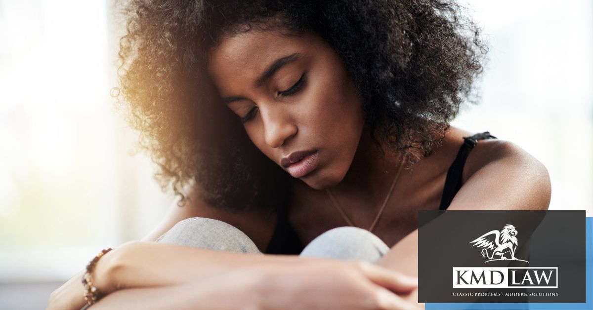 Woman sitting with head down