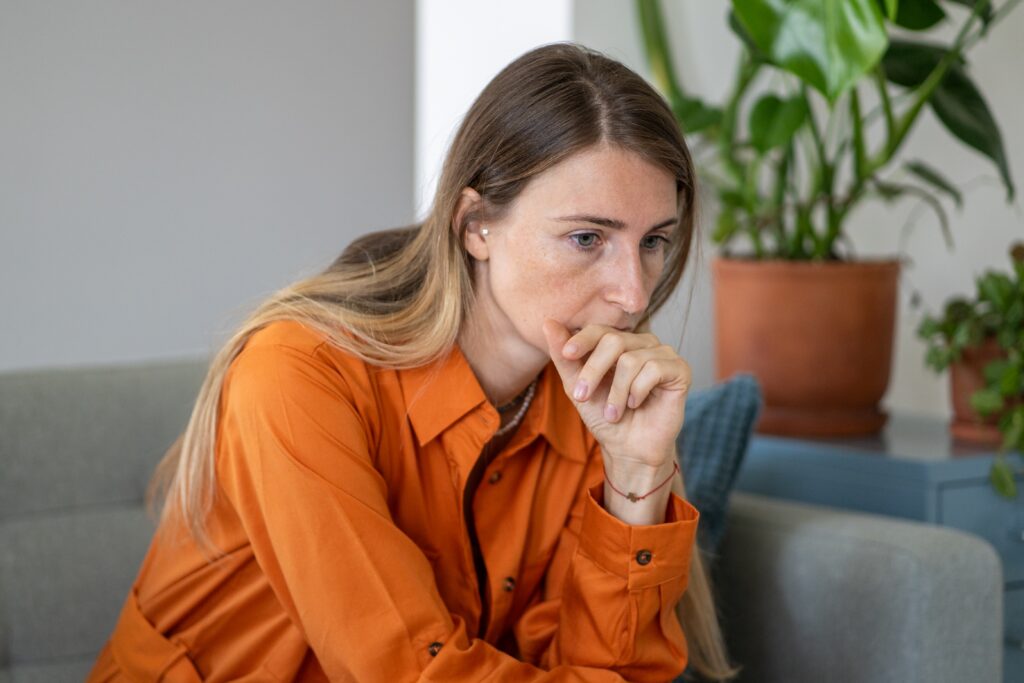 Worried woman touching her chin