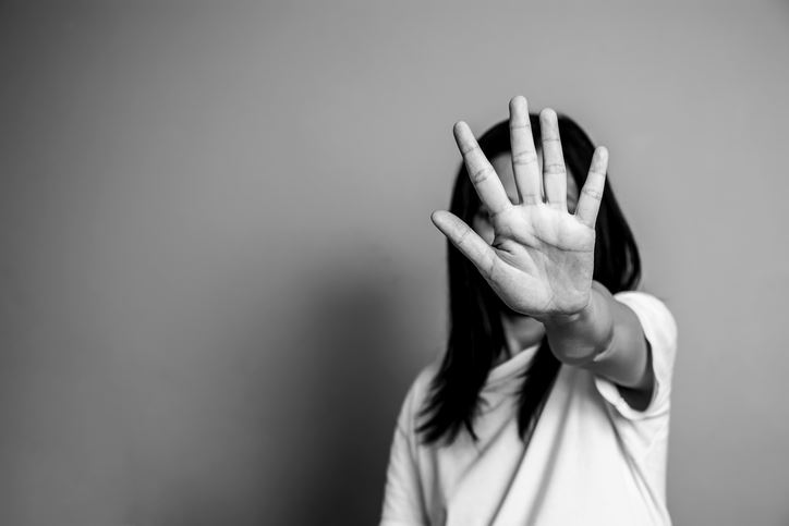 Woman raised her hand in campaign to stop violence against women.